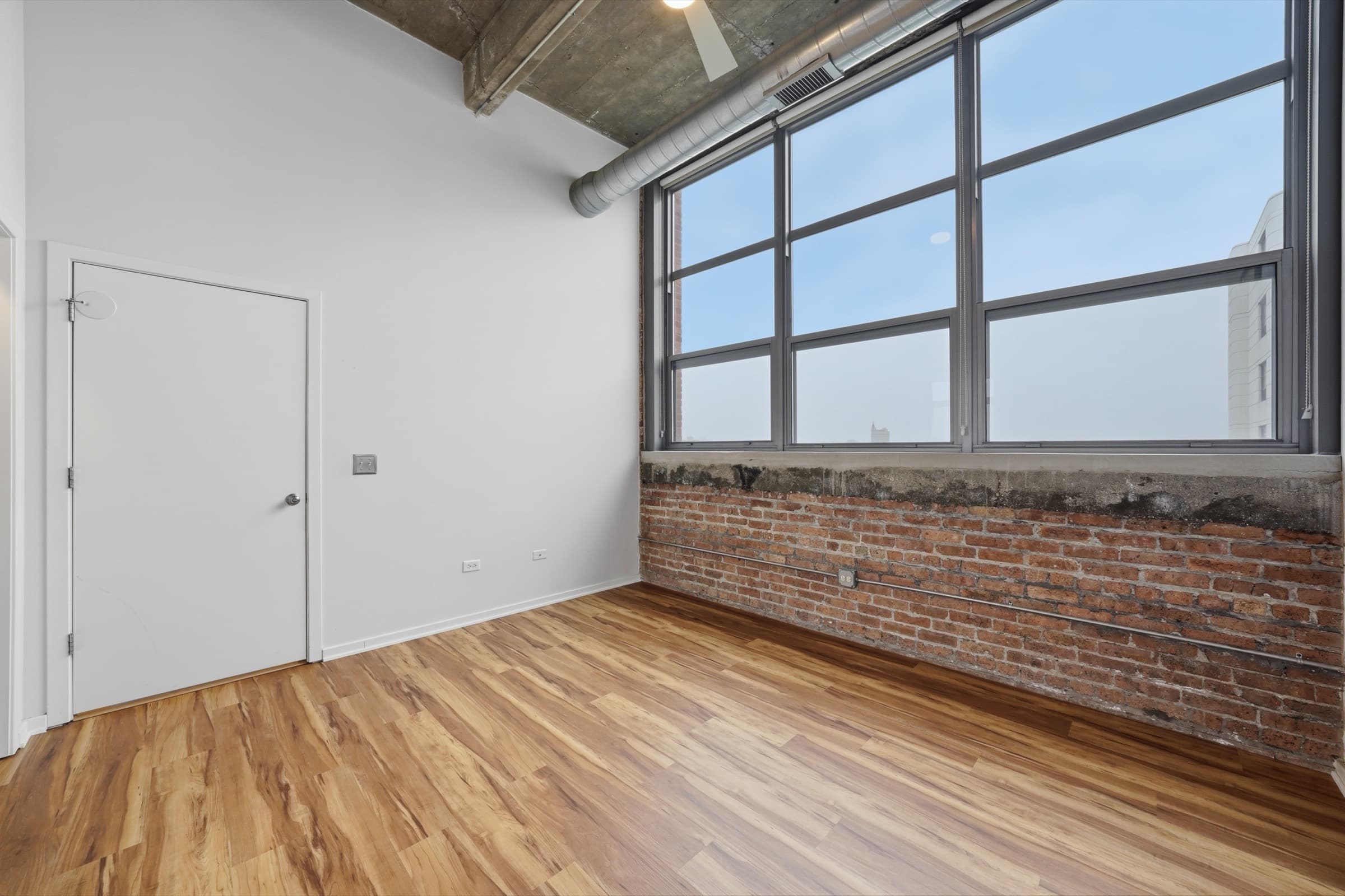Second bedroom with factory glass and hardwood floors